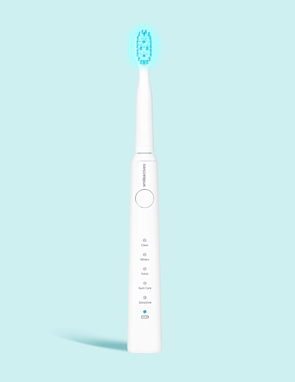 White electric toothbrush with blue bristle head on a light blue background